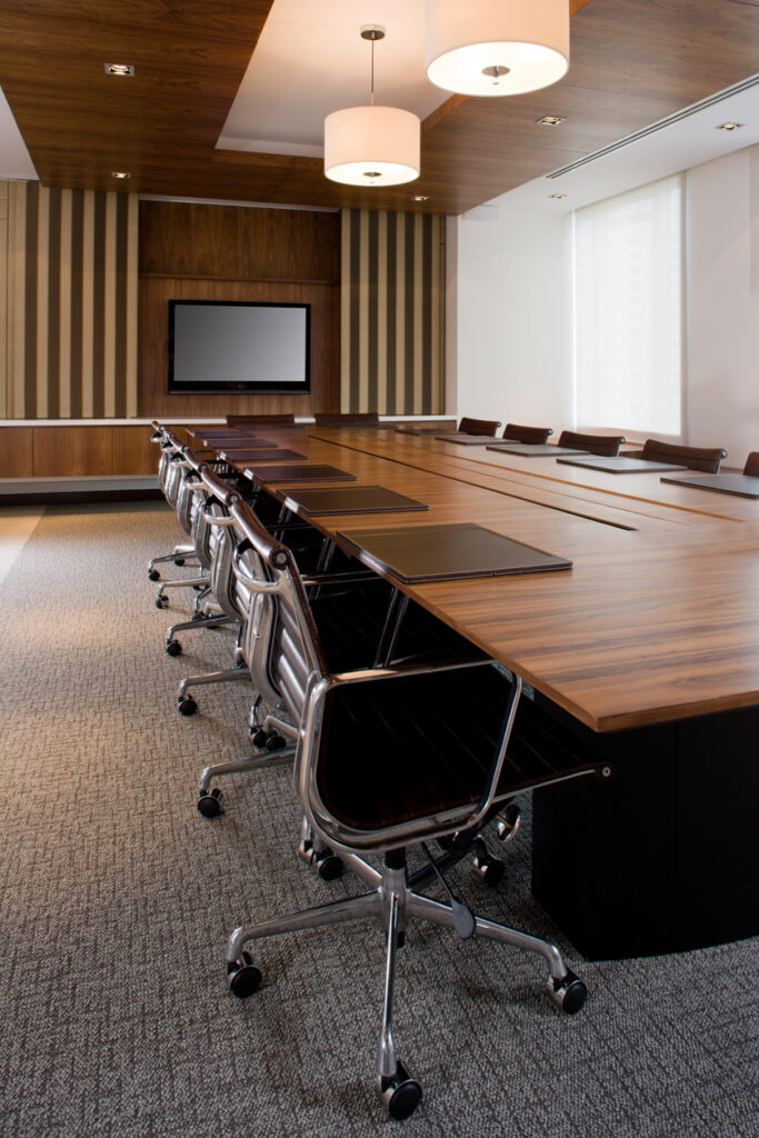 Audio visual systems installed by PVS AV in a modern board room.